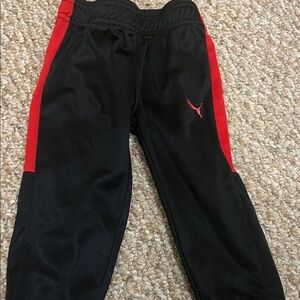 Puma Kids Black Joggers with Red Stripes